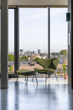 Case Furniture Ella Ottoman สตูลพักเท้าทรงโมเดิร์น หุ้มผ้า Bouclé เนื้อนุ่ม พร้อมฐานให้เลือก 4 แบบ ทั้งเหล็กดำ สเตนเลส ไม้โอ๊ค และไม้วัลนัต ออกแบบโดย Matthew Hilton ใช้คู่กับ Ella Lounge Chair