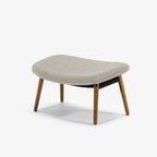 Case Furniture Ella Ottoman สตูลพักเท้าทรงโมเดิร์น หุ้มผ้า Bouclé เนื้อนุ่ม พร้อมฐานให้เลือก 4 แบบ ทั้งเหล็กดำ สเตนเลส ไม้โอ๊ค และไม้วัลนัต ออกแบบโดย Matthew Hilton ใช้คู่กับ Ella Lounge Chair