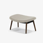 Case Furniture Ella Ottoman สตูลพักเท้าทรงโมเดิร์น หุ้มผ้า Bouclé เนื้อนุ่ม พร้อมฐานให้เลือก 4 แบบ ทั้งเหล็กดำ สเตนเลส ไม้โอ๊ค และไม้วัลนัต ออกแบบโดย Matthew Hilton ใช้คู่กับ Ella Lounge Chair