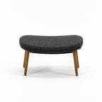 Case Furniture Ella Ottoman สตูลพักเท้าทรงโมเดิร์น หุ้มผ้า Bouclé เนื้อนุ่ม พร้อมฐานให้เลือก 4 แบบ ทั้งเหล็กดำ สเตนเลส ไม้โอ๊ค และไม้วัลนัต ออกแบบโดย Matthew Hilton ใช้คู่กับ Ella Lounge Chair