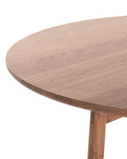 โต๊ะอาหารทรงกลม Case Furniture รุ่น Kigumi ดีไซน์เรียบง่าย ขาไม้ไขว้แบบโปร่งทำจากไม้โอ๊ค/วอลนัต พร้อมท็อปไม้ลามิเนตขอบเฉียง ขนาด 125 ซม. รองรับ 4–6 ที่นั่ง