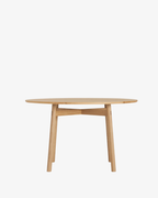 โต๊ะอาหารทรงกลม Case Furniture รุ่น Kigumi ดีไซน์เรียบง่าย ขาไม้ไขว้แบบโปร่งทำจากไม้โอ๊ค/วอลนัต พร้อมท็อปไม้ลามิเนตขอบเฉียง ขนาด 125 ซม. รองรับ 4–6 ที่นั่ง