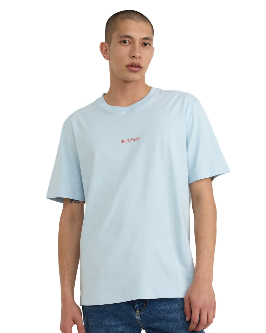 เสื้อยืด True Logo Tee สี Light Blue ทรงบ็อกซี่ แขนสั้น คอกลม ทำจากผ้าฝ้ายออร์แกนิก 100% เนื้อหนา 210 gsm พร้อมโลโก้ Organic Basics ที่ด้านหน้า – True Logo Tee in Light Blue, boxy crewneck short-sleeve T-shirt made from 100% heavyweight organic cotton with Organic Basics logo – sold by Old Pine Trees