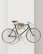 René Bicycle Rack ที่แขวนจักรยานติดผนังจาก ash พร้อม fabric sling สำหรับแขวนหมวก เสื้อผ้า และของใช้ ออกแบบโดย Tomoko Azumi